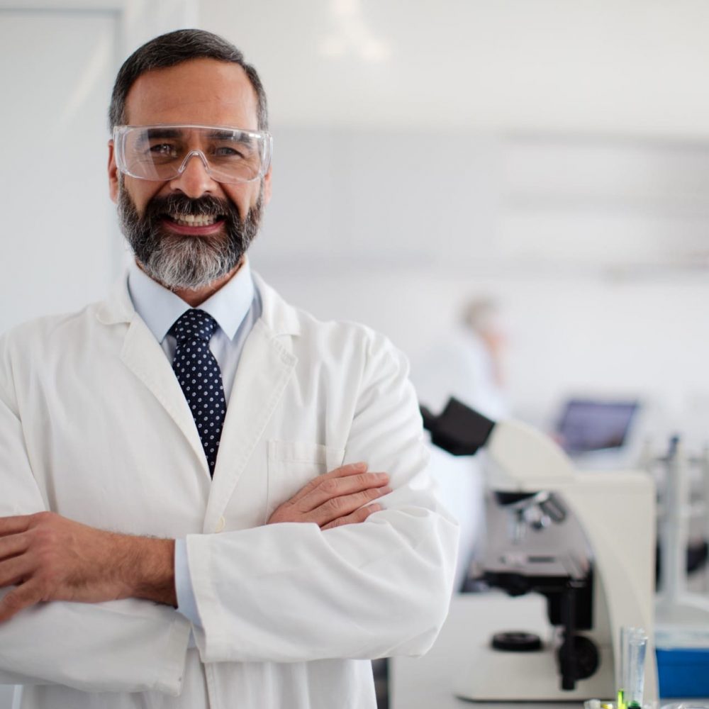 Scientist in laboratory. Shallow DOF. Developed from RAW; retouched with special care and attention; Small amount of grain added for best final impression. 16 bit Adobe RGB color profile.