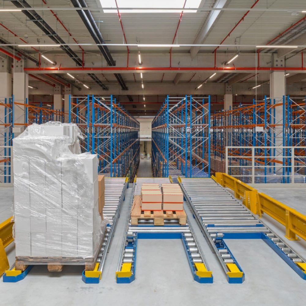 Pallet With Boxes at Floor Mountet Gravity Flow in Distribution Warehouse